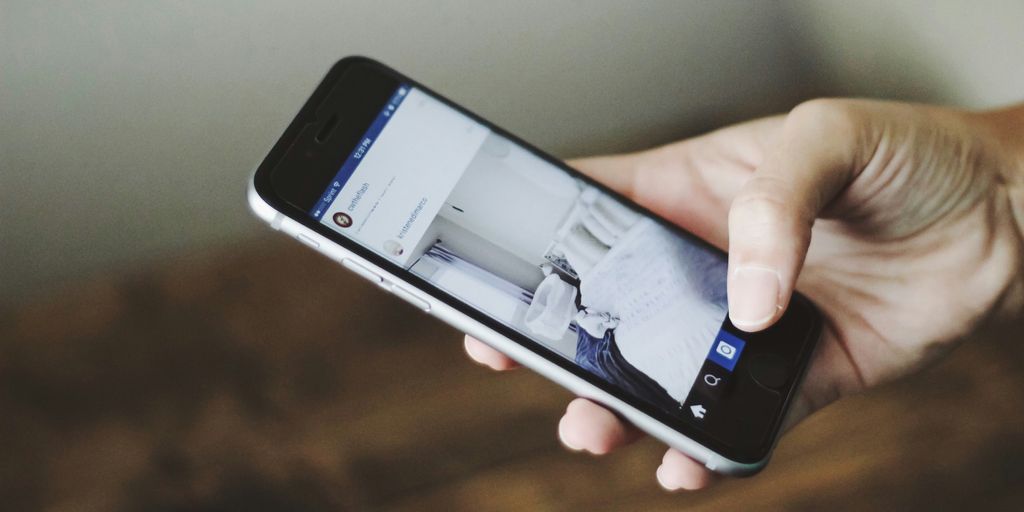 person holding space gray iPhone 6